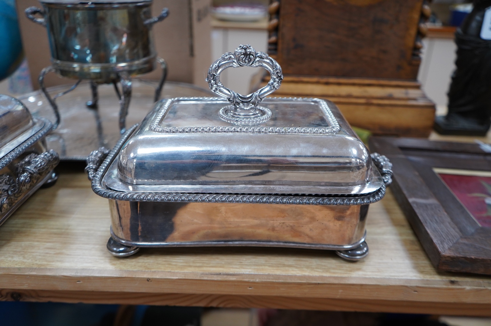 A pair of silver plated entrée dishes, an egg coddler and salver